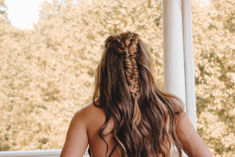 Casual wavy half up prom hairstyles like the one shown are perfect for teen girls 