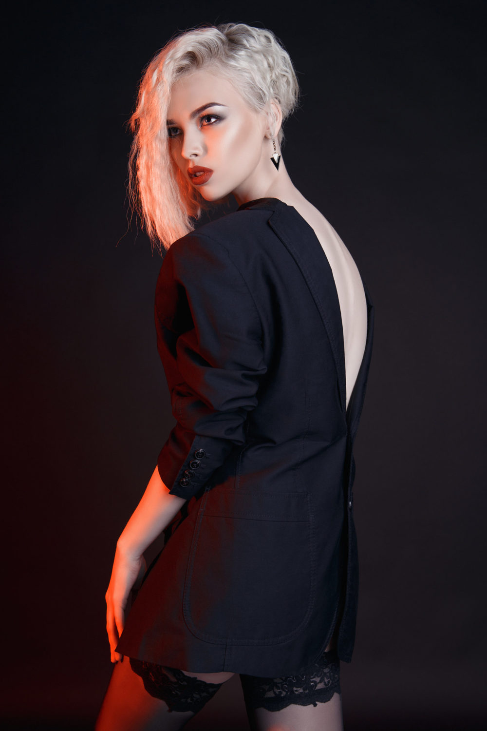 Woman with Platinum Asymmetrical Bixie Cut, one of the top short blonde hair styles